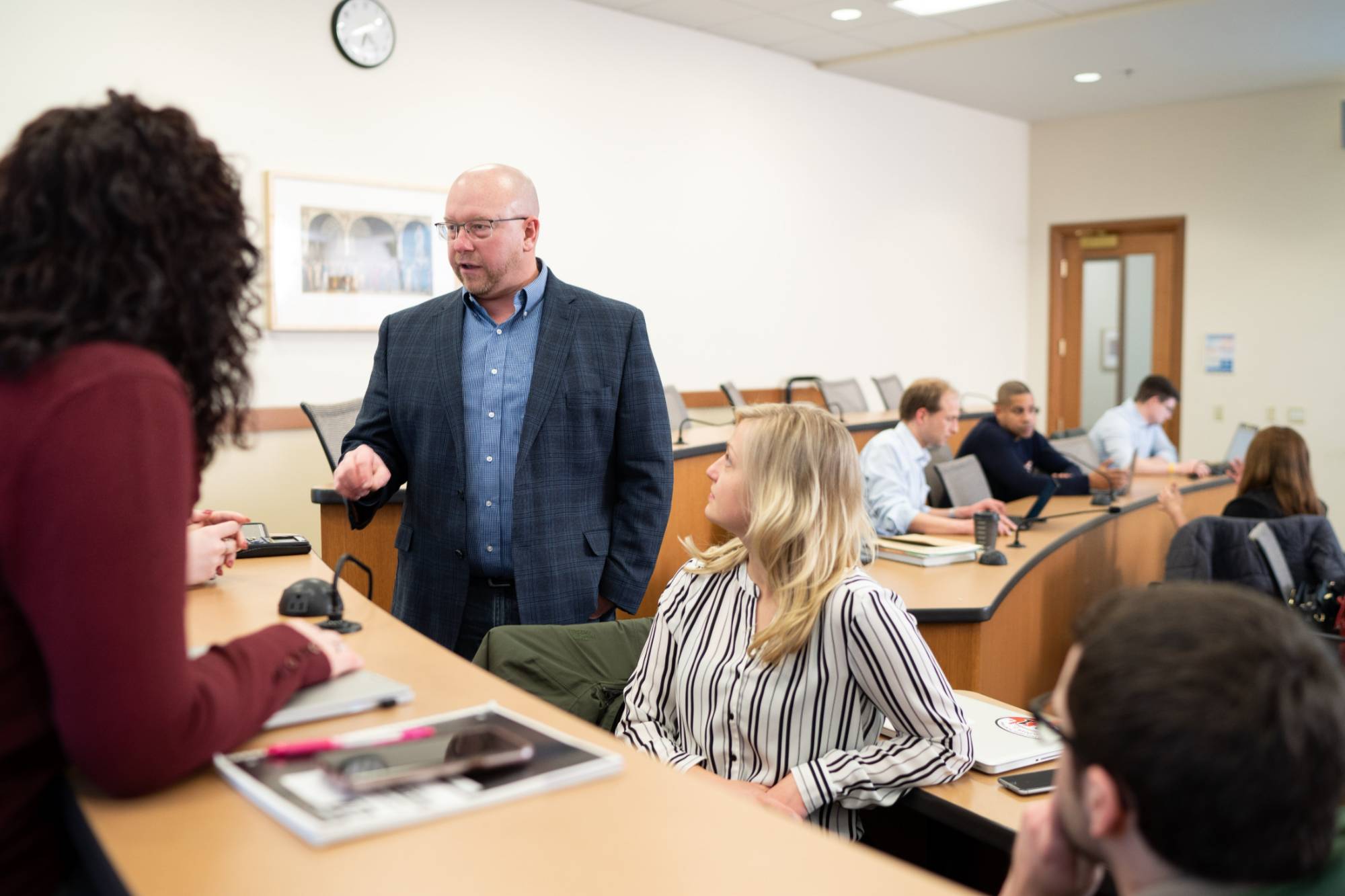 Professor Harper working with students in classroom